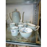 A Royal Worcester 'Woodland' coffee set comprising six cups and saucers, coffee pot,
