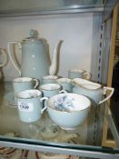 A Royal Worcester 'Woodland' coffee set comprising six cups and saucers, coffee pot,