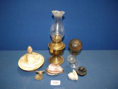 A small quantity of miscellanea including small brass oil lamp, carved shell, stone animals,