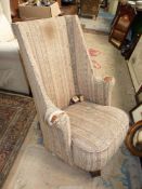 An early horse-hair upholstered Wing Armchair of most uncommon design having a tombstone shaped