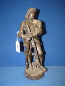 A Spelter figure of a Knight, (sword present but loose), plaque to base marked "Le Roi Jean",