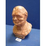 A terracotta bust of Winston Churchill used as a matchstriker,