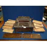 An 'Orchestral Organette' music machine, hand wound, with a good quantity of music rolls,