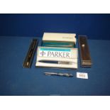 Two Parker ball point pens, cased and two others.