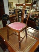 An Arts and Crafts design mixed woods side Chair having a fret-worked splat,