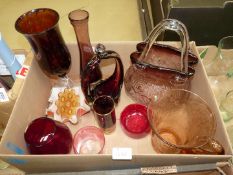 A quantity of coloured glass including a dusky pink handbag shaped vase, crackle glaze jug, vases,