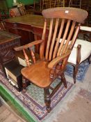 A Windsor open-armed Armchair/Grandfather's Chair having a lath back, turned legs,
