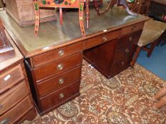 A circa 1900 Oak Kneehole Partners' Desk having a nicely tooled green leather top,