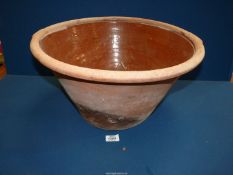 A Terracotta Dairy Bowl with clear glazed interior, 19 1/2'' diameter.