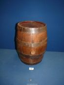 A wooden barrel with stopper, 14" tall.