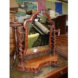 An ornate Mahogany dressing table swing-Mirror having a shaped base and mirrored twist supports.