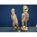 Two carved wood, figures 20" tall.