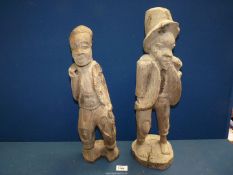 Two carved wood, figures 20" tall.