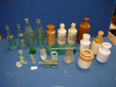 A quantity of stone glaze and old glass bottles and jars including Schweppes, Maraschion,