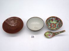 A Chinese brown glazed bowl with Phoenix in relief,