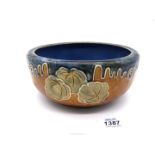 A Royal Doulton Lambeth bowl in blue and ochre with green leaves, 7 3/4" diameter x 3 1/2" deep.