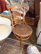 A bentwood French street cafe type Chair having a six stick back and embossed patterned circular