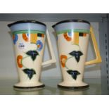 A pair of colourful Art Deco jugs by Sudlows Burslem, some crazing, 8 3/4" tall.