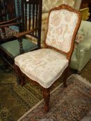 A gold painted wood show-framed side chair standing on carved cabriole front legs and upholstered