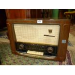 A Grundig electric radio, model 2035W/3D/GB, 22" wide x 14" tall.