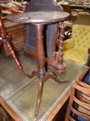 A circa 1900 circular Oak occasional Table having a turned pillar and three splay feet,