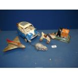 A box of tin plate toys; rat, aeroplane, modern bubble car etc.