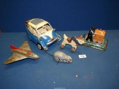 A box of tin plate toys; rat, aeroplane, modern bubble car etc.
