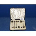 A cased set of six William Suckling Ltd. silver gilt and enamel coffee spoons, Birmingham 1934.