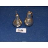 A silver pear shaped salt shaker, Birmingham 1909 13g, together with a white metal 'Thistle and Bee,