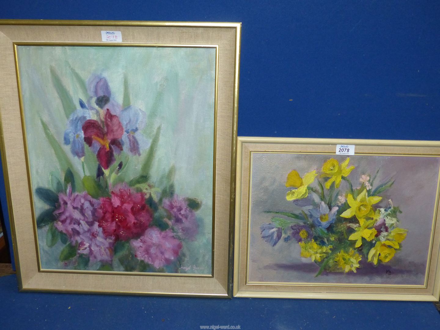 A framed Oil on board of a still life of flowers, initialled lower right M.B.