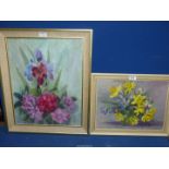 A framed Oil on board of a still life of flowers, initialled lower right M.B.