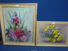 A framed Oil on board of a still life of flowers, initialled lower right M.B.