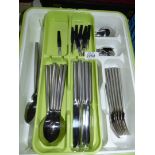 A Stellar six place cutlery set and two serving spoons in cutlery tray.