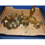 A quantity of brass including finger bowl with floral and bird design, teapot stand, small boat,