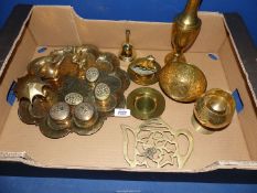 A quantity of brass including finger bowl with floral and bird design, teapot stand, small boat,
