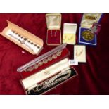 A quantity of costume jewellery including beaded earrings in boxes, replica medal, bowling medal,