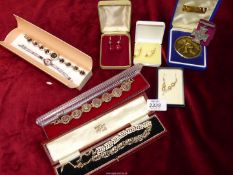 A quantity of costume jewellery including beaded earrings in boxes, replica medal, bowling medal,