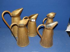 Five brass water jugs/pitchers, two being marked "R. Penny and Son and Co.