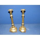 A pair of lightweight brass candlesticks, 14 1/4" tall.