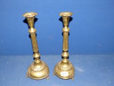 A pair of lightweight brass candlesticks, 14 1/4" tall.