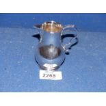 A silver cream jug, London 1899, makers mark C.S., 77g.