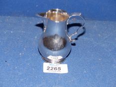 A silver cream jug, London 1899, makers mark C.S., 77g.