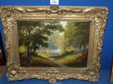 An ornately framed oil on canvas of wooded landscape with figures walking the path,