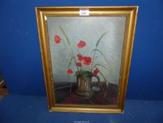 A framed Oil on board depicting a tankard with poppies and corn.