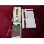 A ladies Daniel Wellington watch, Japanese movement and mesh strap, boxed with manual.