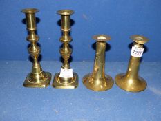 Two pairs of brass candlesticks including dimple effect, 5'' tall, and with weighted bases,