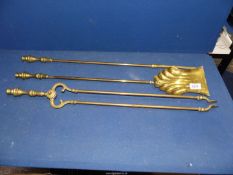 A set of three brass Fire Irons with shell shape to the top of the shovel