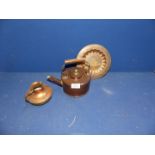 A copper kettle, copper and brass jug and Islamic style plate.