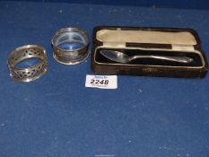 Two silver Napkin Rings and cased Teaspoon, Birmingham, various makers and dates, 36 grams.