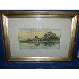 A framed and mounted Watercolour depicting River scene with village and figures fishing,
